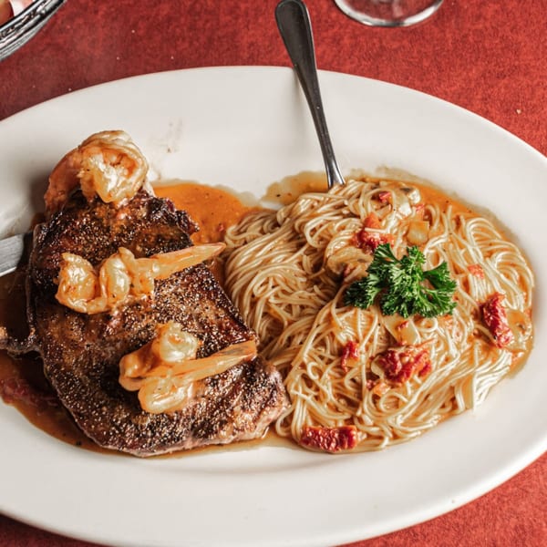 Pronto's Italian Restaurant's steak and shrimp with angel hair pasta, mushrooms, and sun-dried tomatoes.